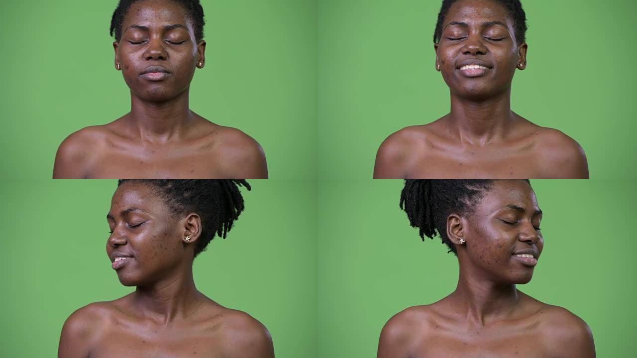 年轻美丽的非洲女人赤裸着眼睛放松
