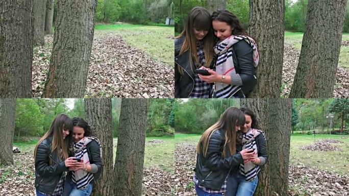 在秋季公园使用智能手机的惊人户外青少年乐趣。索尼uhd steadycam拍摄