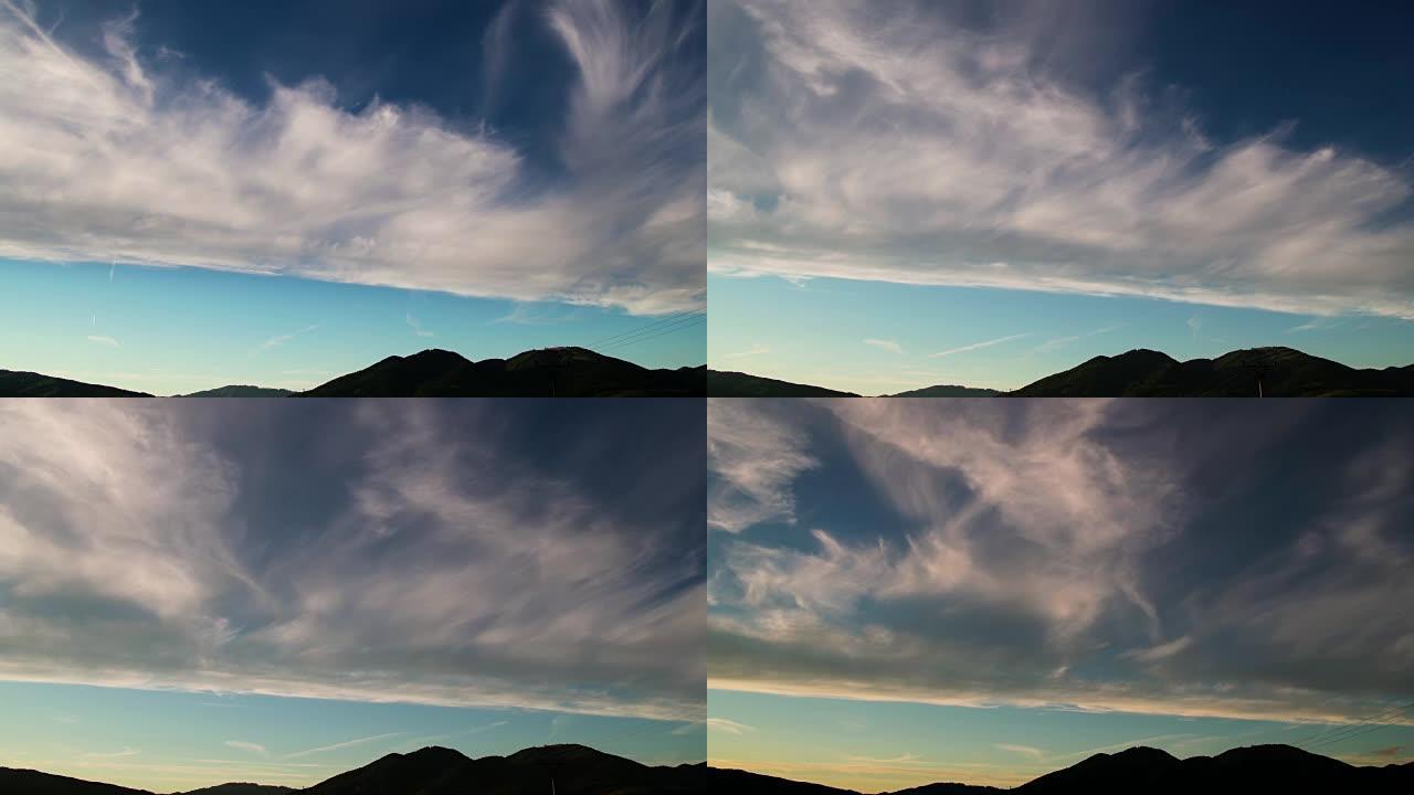 日落时反转期间云层中的山脉的延时
