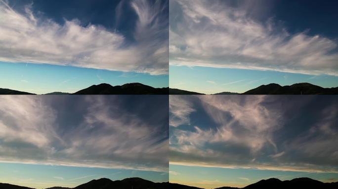 日落时反转期间云层中的山脉的延时