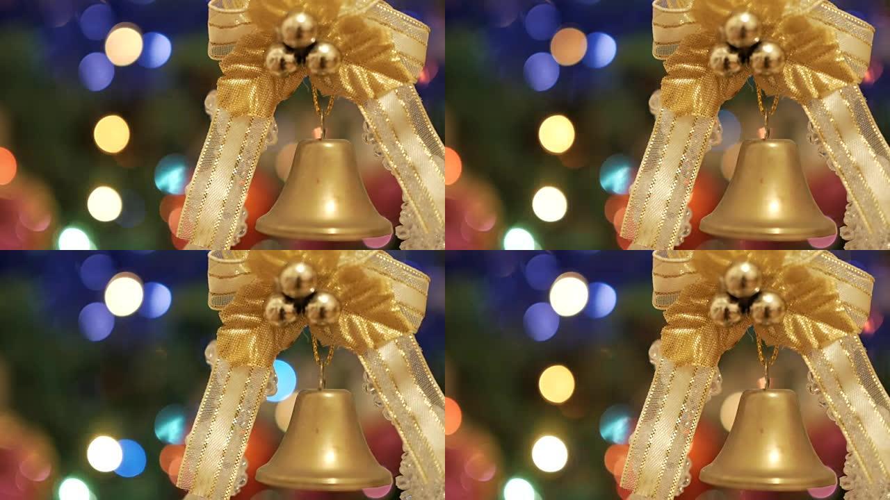 圣诞树上的圣诞球。圣诞节和新年装饰。抽象模糊的Bokeh假期背景。闪烁的花环。贝尔在前景。