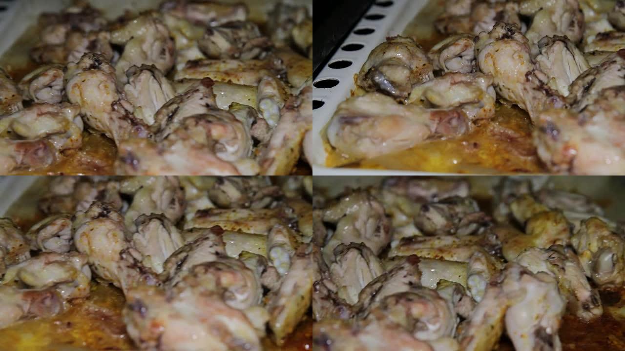 鸡肉是在旧烤箱里煮的。在沸腾的油中准备的炸鸡翅的特写视图。