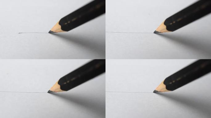 艺术家手画木制铅笔在纸上写线。
