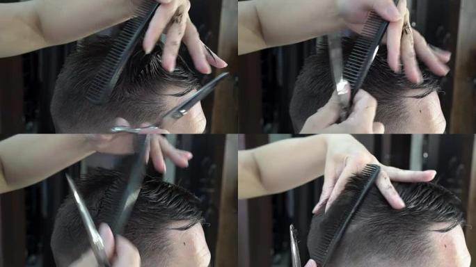 一个在理发店理发的人。理发师剪了他的发梢。特写，高度细节。
