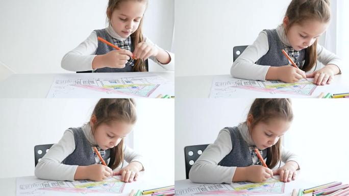 Little girl drawing a picture on white room. 7 yea