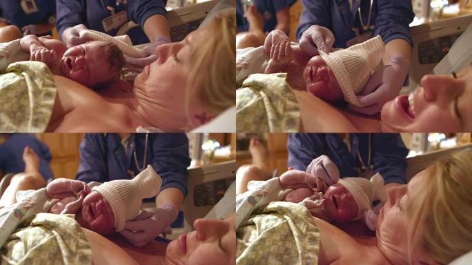 刚出生的婴儿在戴上帽子以保持温暖前几分钟