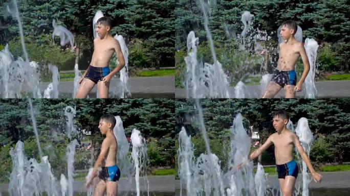 这个男孩正在喷泉里玩耍