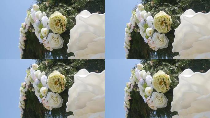 用鲜花装饰的婚礼拱门。特写