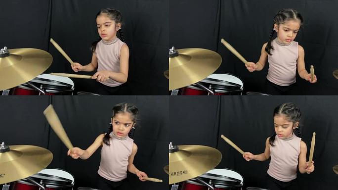 5岁女孩在鼓上练习