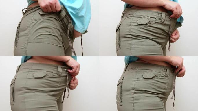 超重的女人穿小牛仔裤。