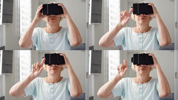 金发碧眼的高级女性在家里使用VR 360眼镜。进行浏览、缩放和点击手势
