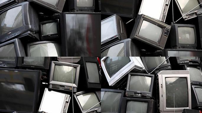 泰国曼谷-2015年1月8日: 旧电视电子垃圾，垃圾，垃圾，可以回收利用。破碎的电视堆叠在回收和环境