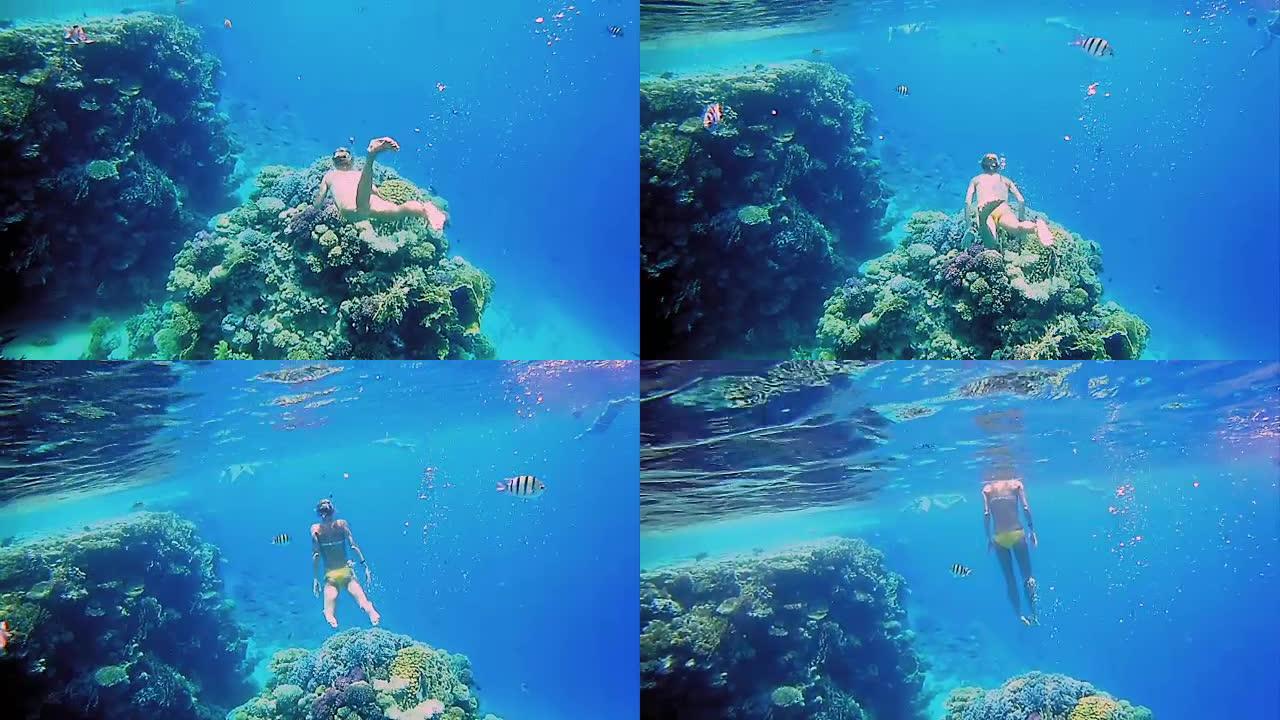 女人穿着浮潜潜水面具在水下潜水