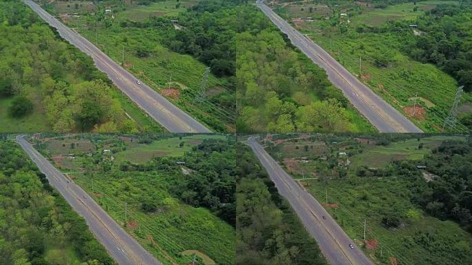 沿着乡村公路飞越田野。在蓝天和云的背景下。泰国