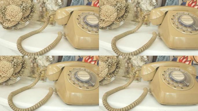 拨打复古旋转复古风格电话的4K. dolly。复古色调的薄膜染料。旧电信技术