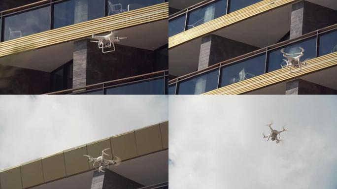 拍摄无人机在豪华酒店阳台前飞行