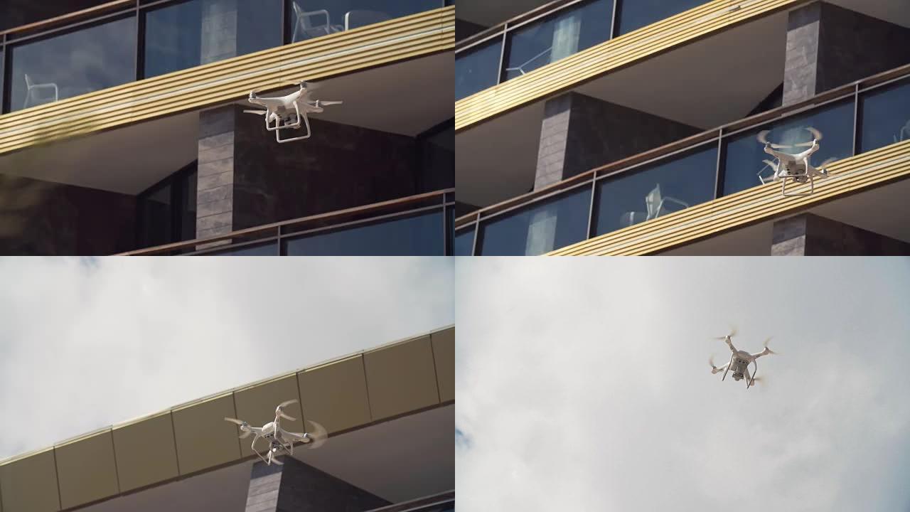 拍摄无人机在豪华酒店阳台前飞行