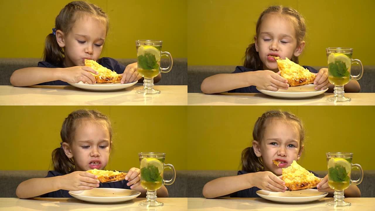 咖啡馆里的小女孩正在用手吃披萨。桌子上是一杯茶和薄荷，蜂蜜和柠檬。