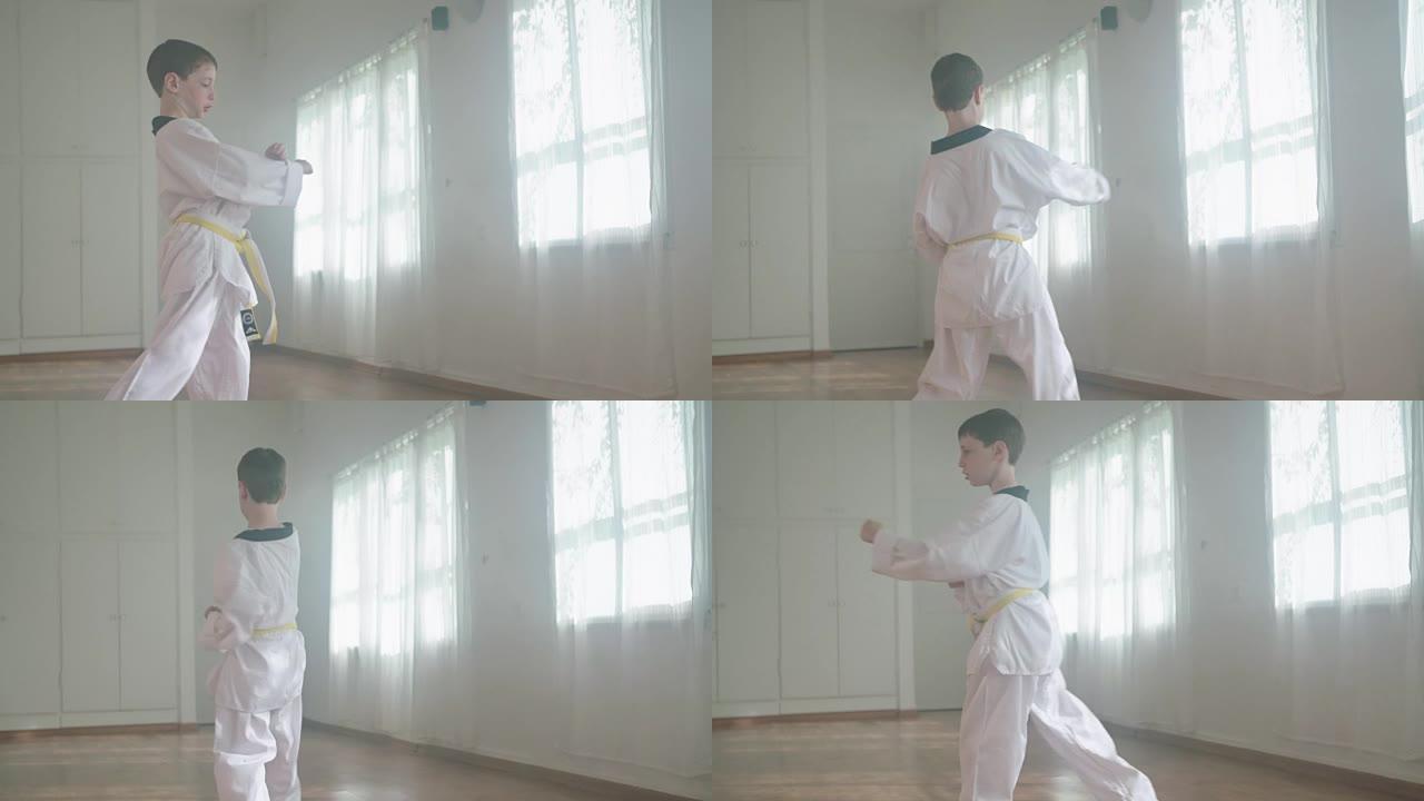 一个小男孩练习武术的慢动作镜头