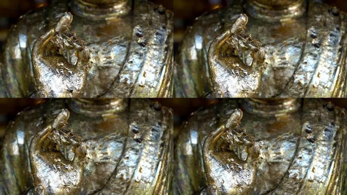 佛像之手。佛像手工雕塑。金佛手和风。