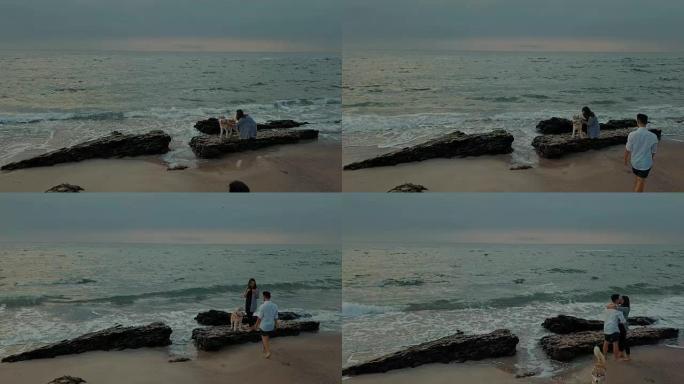 男人向女友求婚，送哈士奇狗戒指。海滩上的订婚