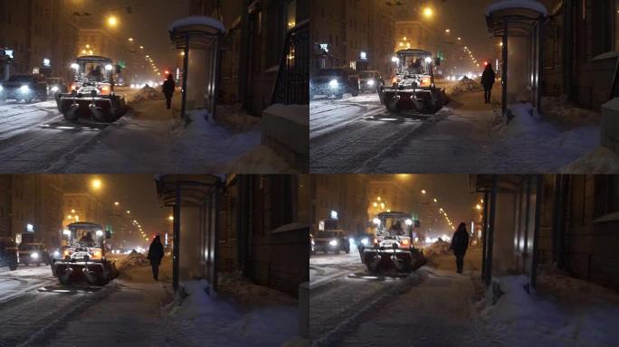 冬季大雪中夜间沿街道行驶的人和汽车