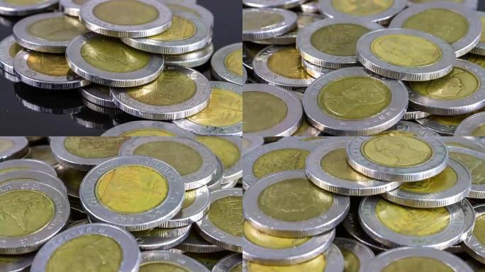 4k延时拍摄，泰国十泰铢硬币堆叠。