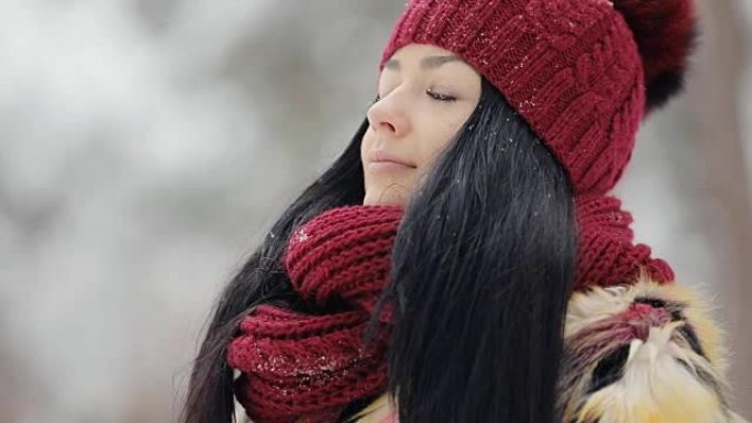 Woman in red hat breathe fresh air at frost winter