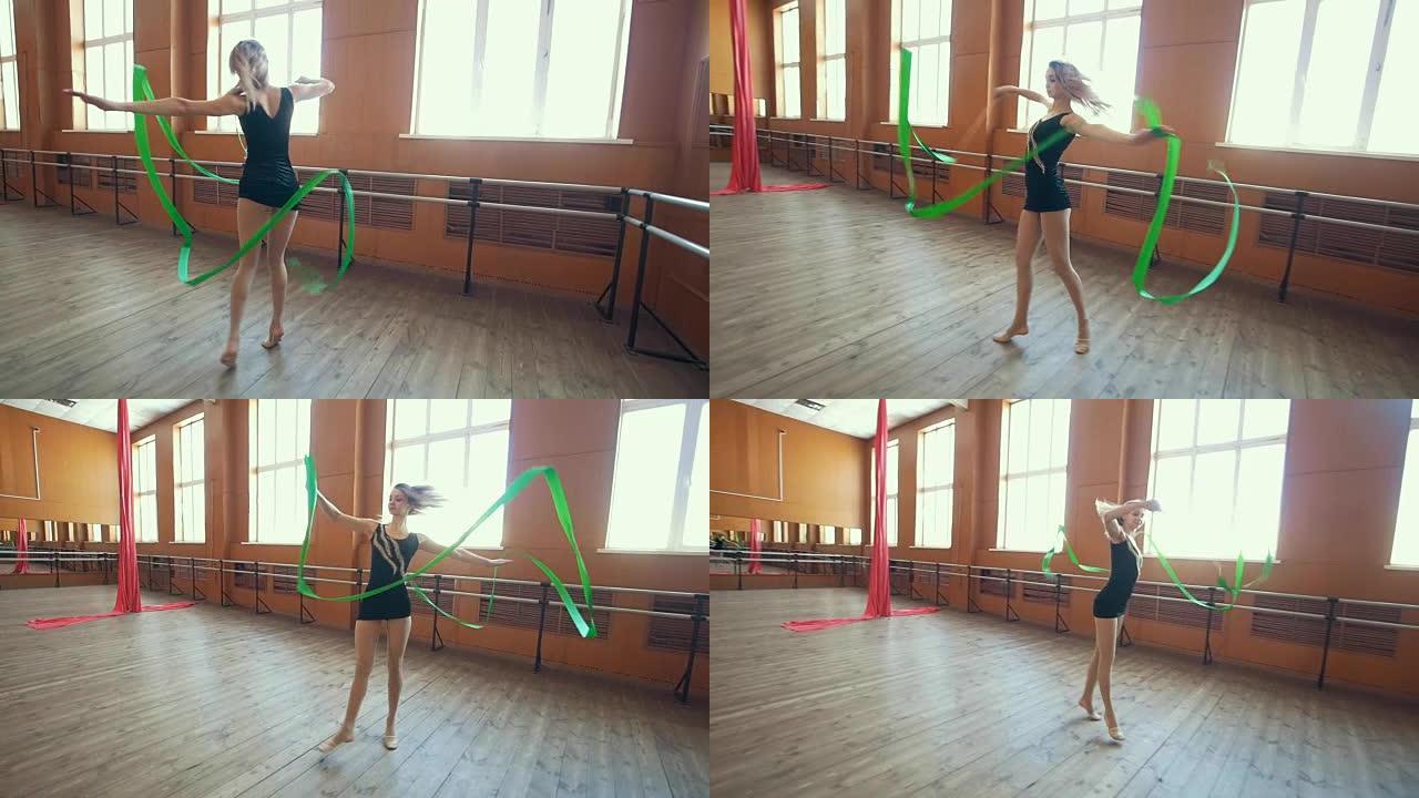 体操-年轻女子用绿丝带跳舞-训练体操，慢动作