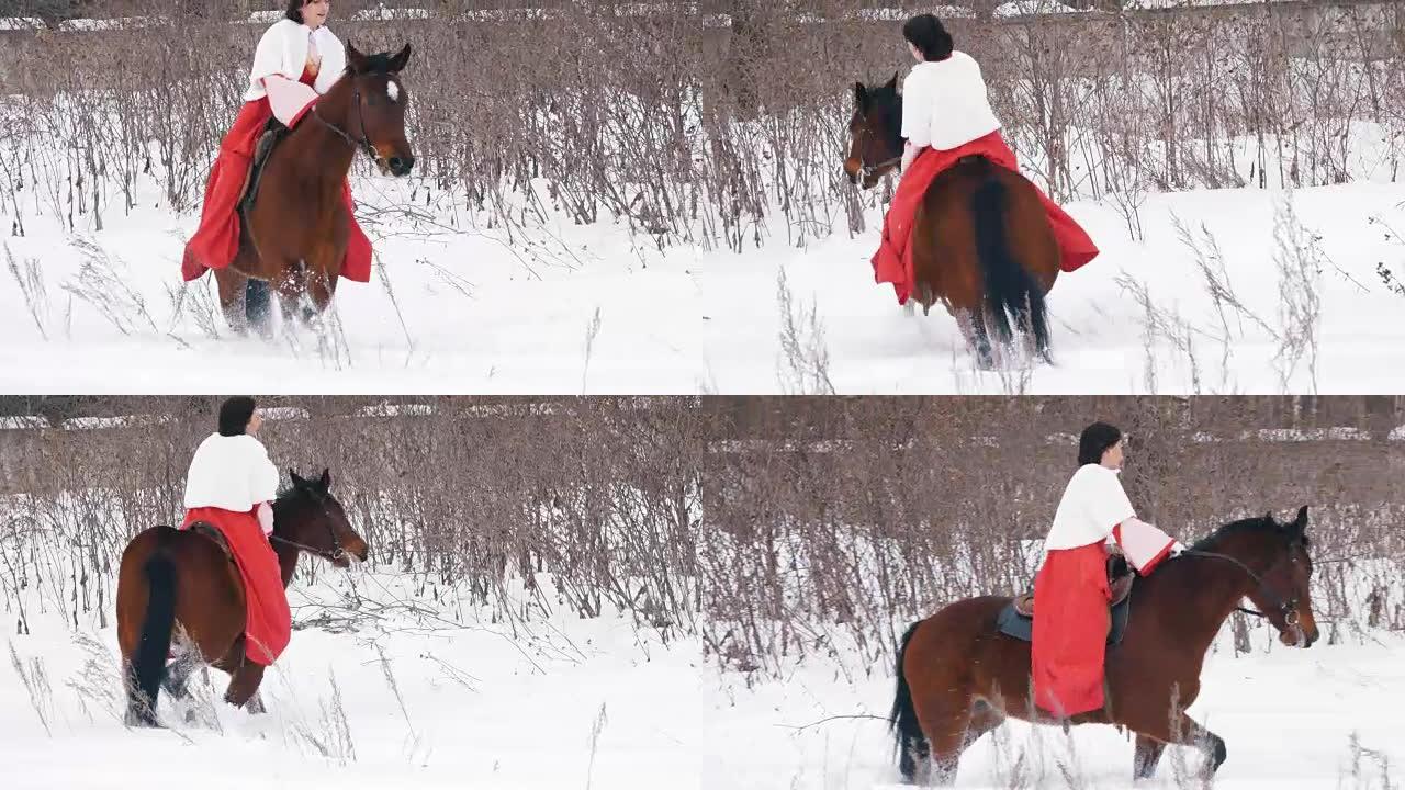 穿着红色连衣裙的迷人年轻黑发女人在冬天骑着马穿过雪地