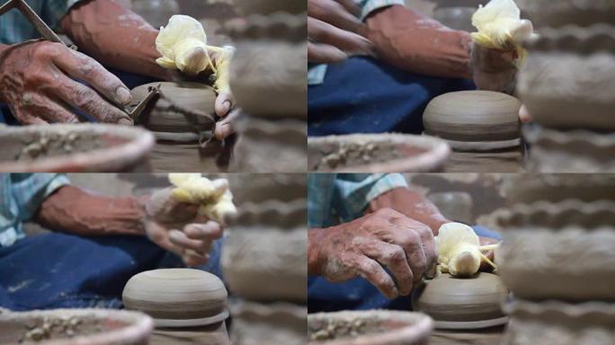 手在做陶器。