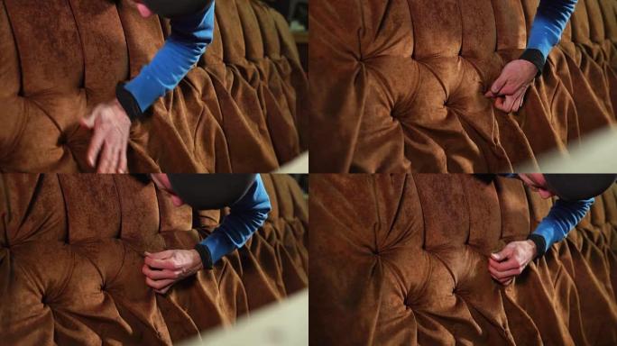 The master corrects the soft upholstery of the cha