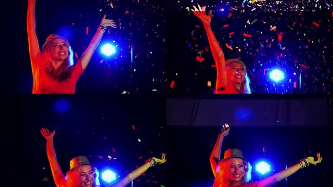 美丽的女孩在派对上跳舞很开心。