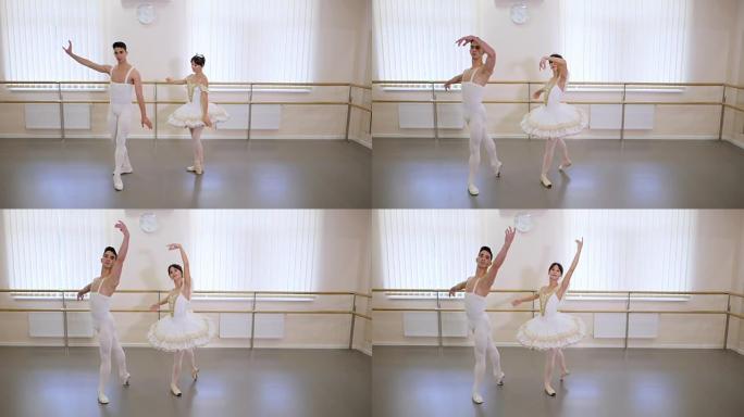 在芭蕾舞厅或工作室排练，内部简约。年轻的专业性感舞者的夫妇穿着漂亮的服装一起跳舞。慢动作