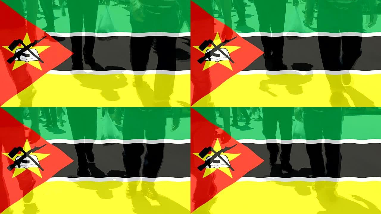 莫桑比克国旗和人们以行走为背景