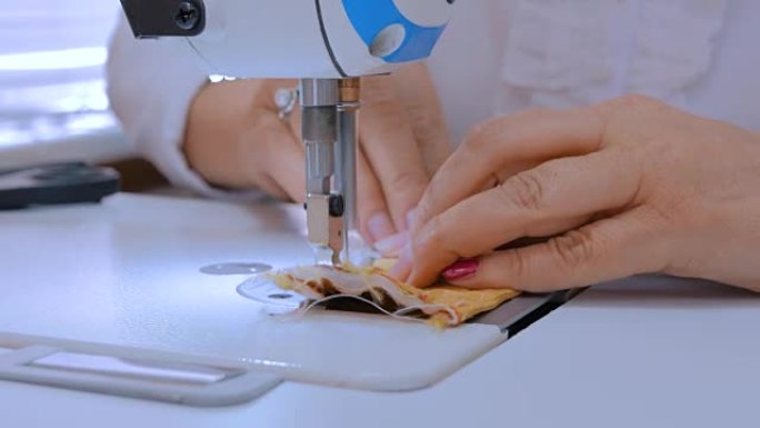 专业裁缝，时装设计师用缝纫机缝制衣服