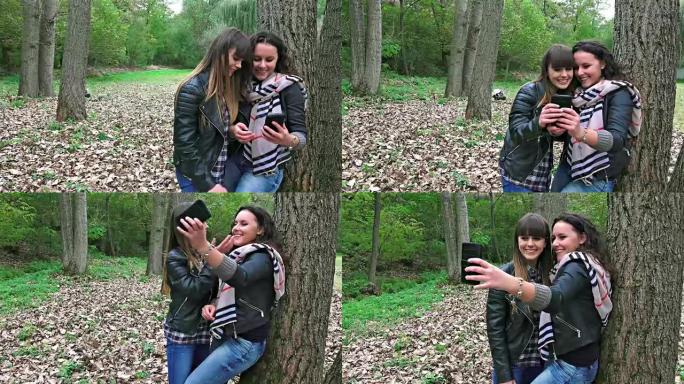 两个快乐的女朋友在公园里用智能手机自拍。索尼uhd steadycam拍摄，股票视频