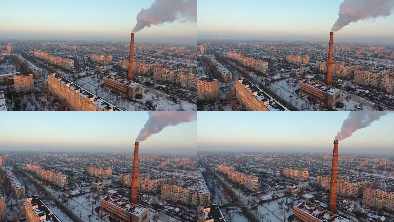 空中拍摄高热气体烟囱，在冬季日落时缓慢冒烟