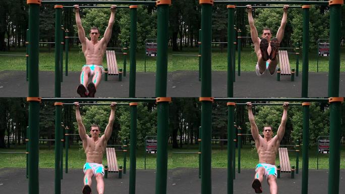 运动肌肉发达的人在公园的双杠上进行腹部锻炼。男子抬腿。男人在酒吧做角度。