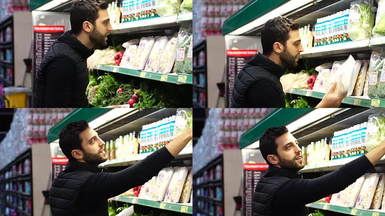 男子在超市选择产品