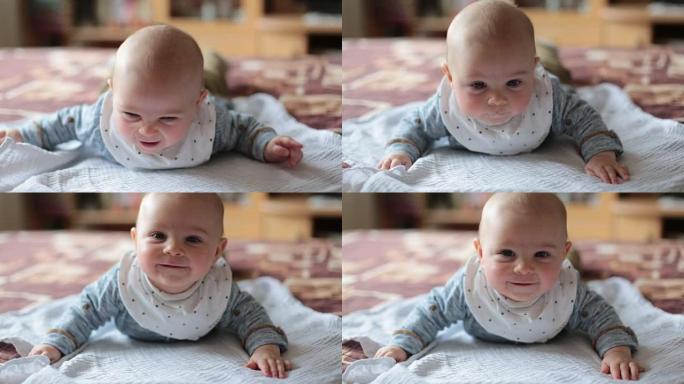 Close portrait of little cute smiling baby boy at 
