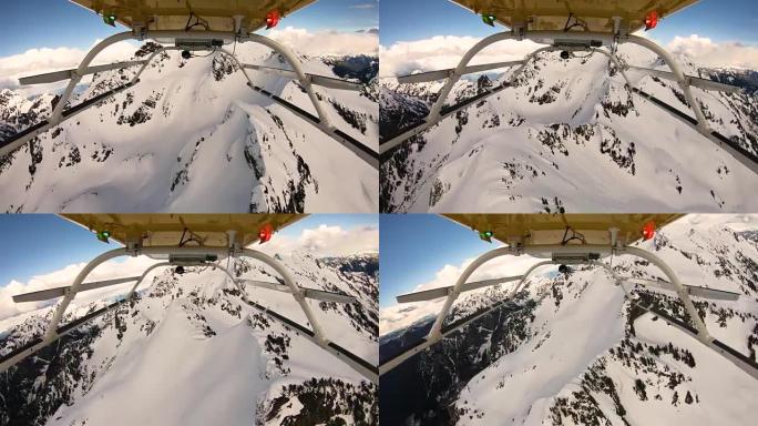 直升机视点飞行在雪山火山口锯齿状悬崖山峰三指华盛顿喀斯喀特山脉上方