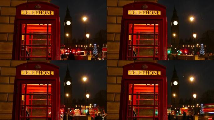 晚上，英国伦敦大本钟和国会大厦前有一个标志性的红色电话亭。