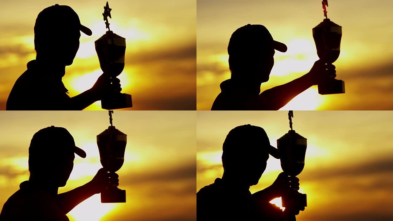 高尔夫锦标赛冠军奖杯的日落剪影