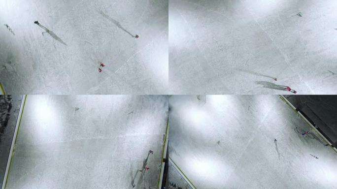 与滑冰人一起在溜冰场上拍摄的摄像机的旋转