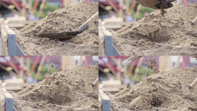 铲子从大堆中挖出沙子关闭
