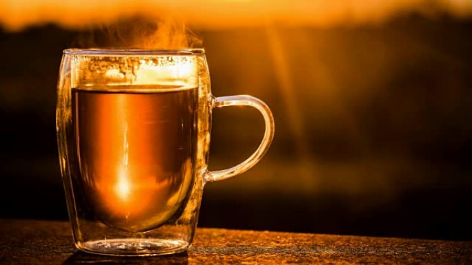 Cinemagraph of hot tea in glass at morning light