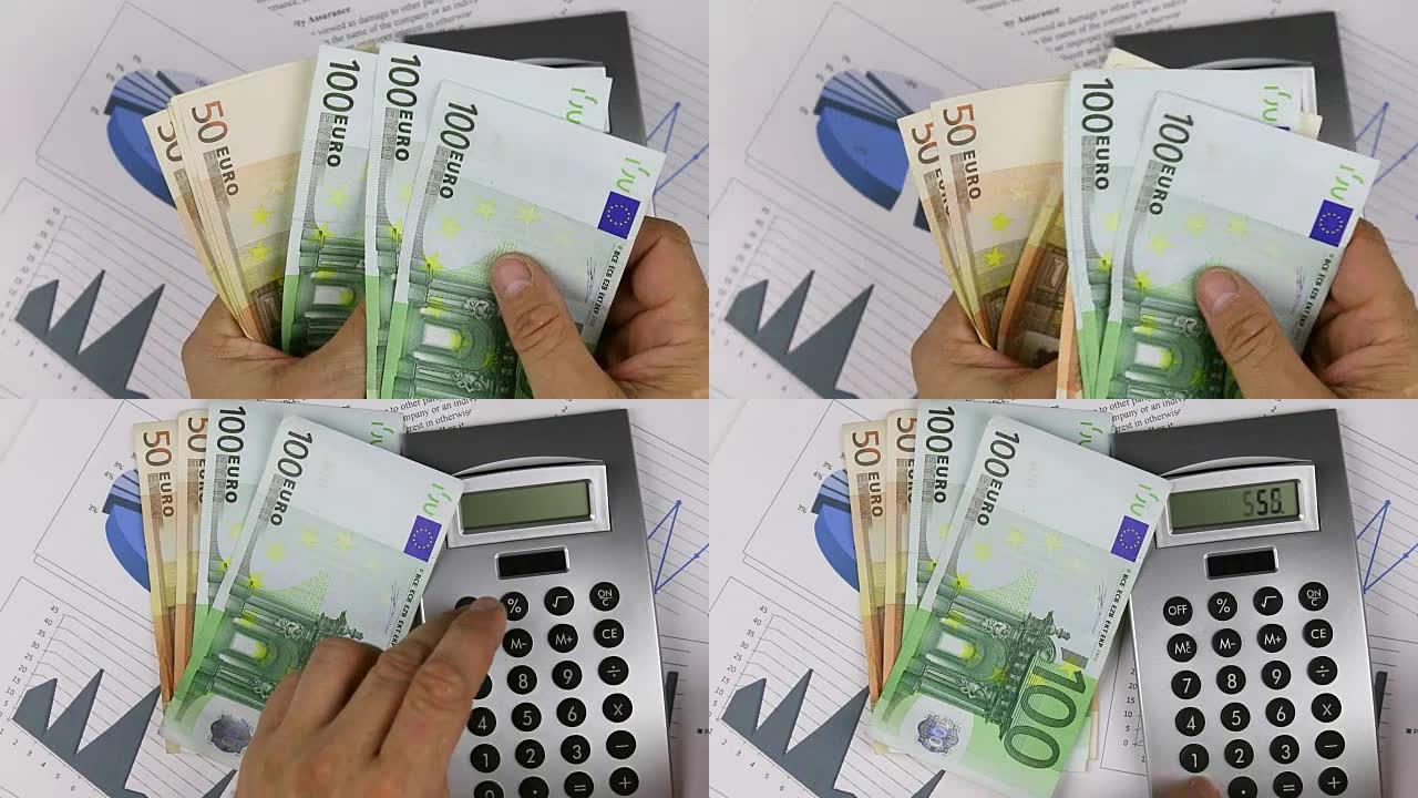 男人在图表的背景上数钱，并在计算器上收集金额。特写