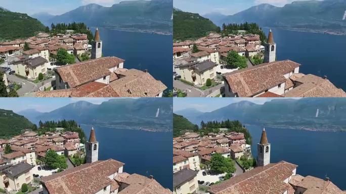 意大利。山上的教堂和老城区。美丽的加尔达湖被群山环绕的全景。无人机视频拍摄