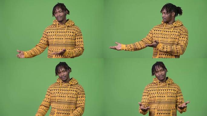 年轻英俊的非洲男子展示一些东西